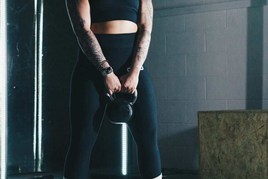 Woman training with a kettlebell in the gym