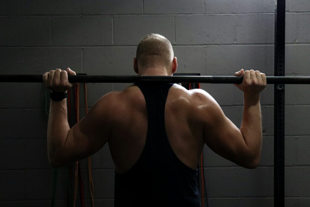 Man lifting weights during a strength workout